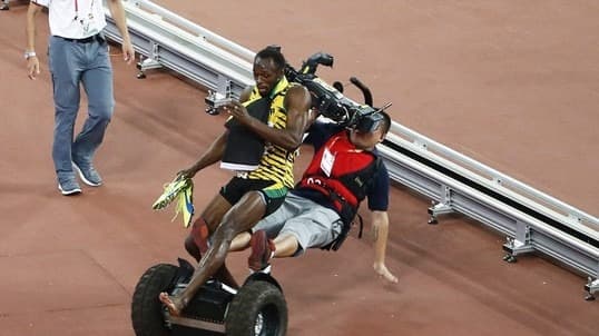 مصور صيني يطيح بـ بولت بطريقة مضحكة